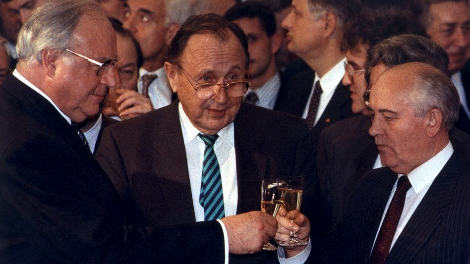 File photo of Helmut Kohl toasting with former Soviet leader Mikhail Gorbachev and former German Foreign Minister Hans-Dietrich Genscher