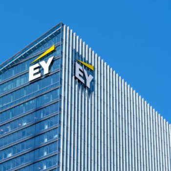 Toronto, Canada - May 5, 2019:  Sign and logo of EY on EY Tower in downtown Toronto. Ernst & Young is a multinational accounting firms headquartered in London, England.